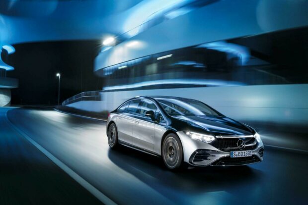 A Mercedes Benz Eqs is shown driving smoothly through a curved road with modern lighting, HD Desktop Wallpaper