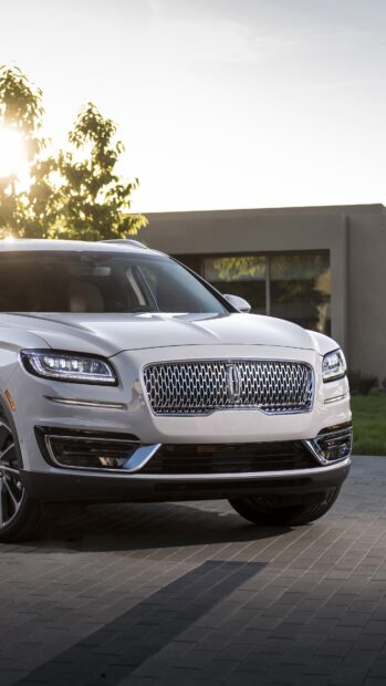 A white Lincoln car is parked on the driveway of a modern house during daytime, 4K Phone Wallpaper
