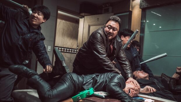 Ma Dong Seok is holding a man down during an intense fight scene, HD Desktop Wallpaper