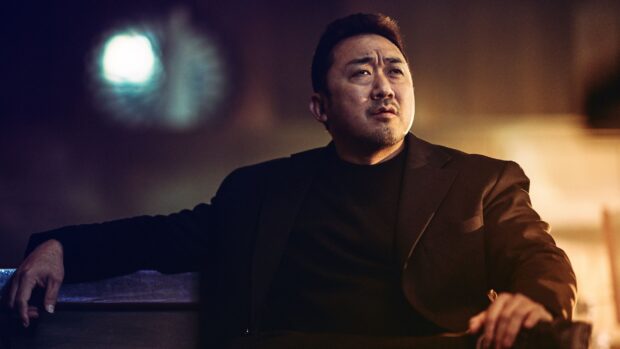 Ma Dong Seok looks serious sitting in dim light, HD Desktop Wallpaper