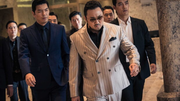 Ma Dong Seok leading a group of men dressed in suits walking through a building, HD Desktop Wallpaper