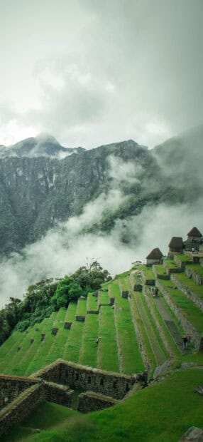 Machu Picchu terraces surrounded by clouds showcase Peru wallpapers landscape, 2K Phone Wallpaper