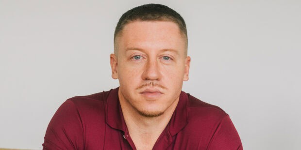 Macklemore is looking directly at the camera with a neutral expression, HD Desktop Wallpaper
