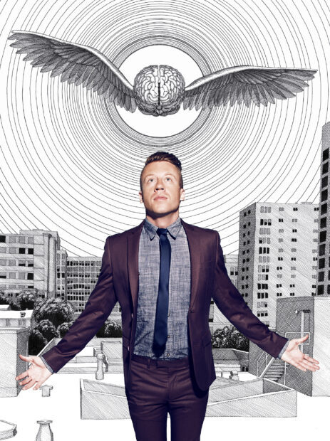 A man in a suit stands with open arms below a detailed brain with wings design, 2K Desktop Wallpaper