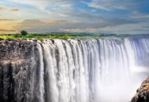 Devils Pool Zambia features a majestic waterfall cascading over rocky cliffs, HD Desktop Wallpaper