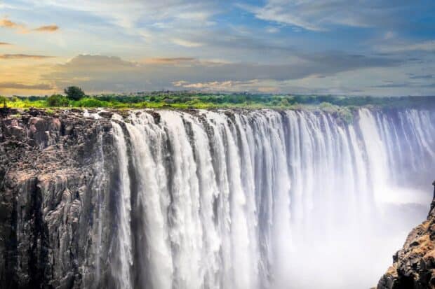 Devils Pool Zambia features a majestic waterfall cascading over rocky cliffs, HD Desktop Wallpaper