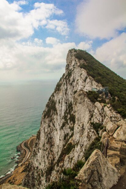 The majestic Gibraltar Rock rises above the coastline with dramatic cliffs and clear skies, HD Mobile Wallpaper