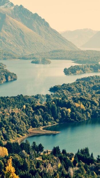 The Nahuel Huapi landscape features a serene lake surrounded by forested hills and mountains, HD Mobile Wallpaper