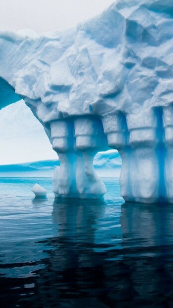 Stunning glacier formations reflect over calm water in the Arctic, 2K Mobile Wallpaper
