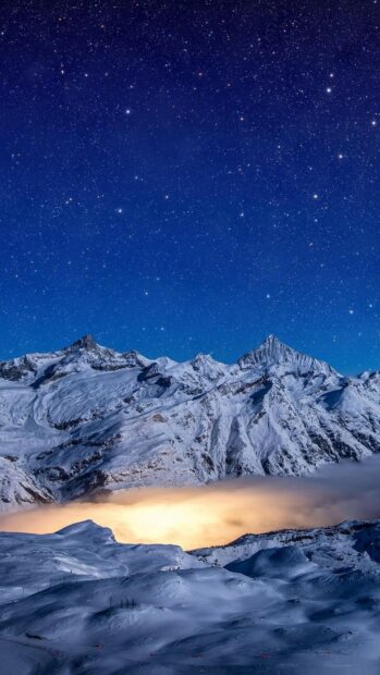 A majestic glacier glows under a clear starry sky at night, 4K Phone Wallpaper