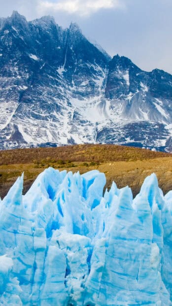 The majestic glacier contrasts with rugged mountain peaks in this natural scene, HD Phone Wallpaper