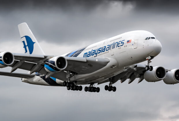 The Airbus A380 is shown flying with Malaysia Airlines livery against a cloudy sky, HD Desktop Wallpaper