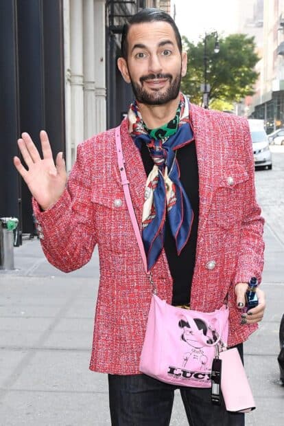 A man in a bright red jacket and colorful scarf carries a pink Marc Jacobs bag on the street, HD Mobile Wallpaper