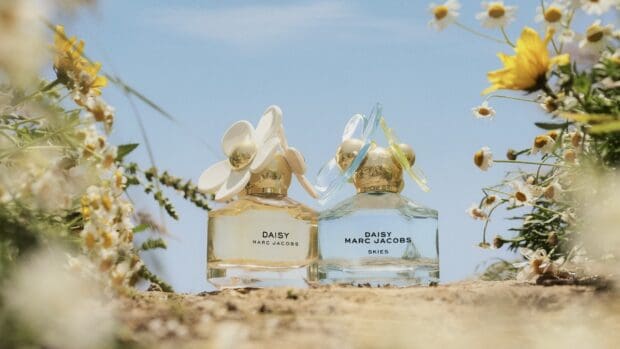 Two Marc Jacobs wallpapers featuring floral perfume bottles under a clear sky, HD Desktop Wallpaper