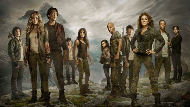 The cast poses together in a rugged outdoor setting featuring Marie Avgeropoulos, HD Desktop Wallpaper