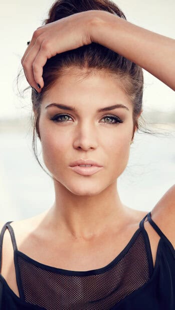 A close up portrait of Marie Avgeropoulos showing her natural beauty and striking eyes, 4K Phone Wallpaper