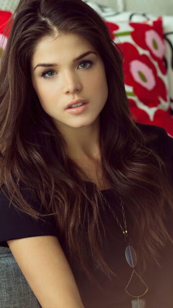 A close up portrait of Marie Avgeropoulos with long hair and a chain necklace, 2K Phone Wallpaper