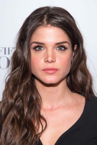 Marie Avgeropoulos Wallpapers features a close up portrait of the actress with wavy hair, 2K Mobile Wallpaper