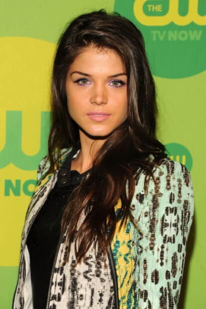 Marie Avgeropoulos Wallpapers showing a woman with long brown hair and green eyes wearing a patterned jacket, 2K Portrait Desktop Wallpaper