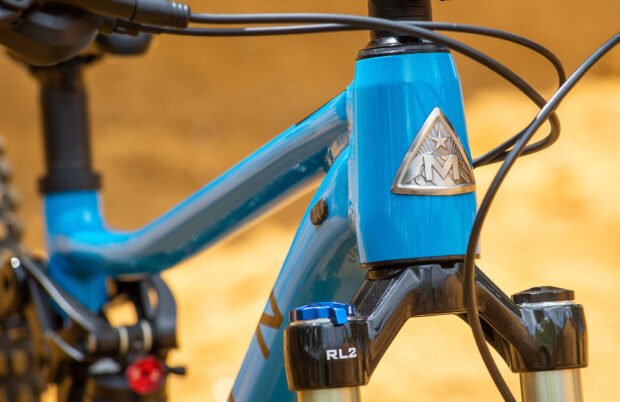 A close up view of a blue Marin Bikes frame with detailed logo and components, HD Desktop Wallpaper