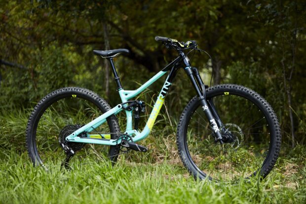 A Marin bike stands on grass with trees in the background, 2K Desktop Wallpaper