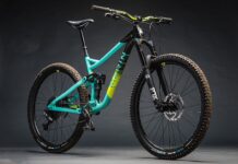 A Marin Bikes mountain bike with a teal frame and black fork on a gray background, HD Desktop Wallpaper