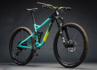 A Marin Bikes mountain bike with a teal frame and black fork on a gray background, HD Desktop Wallpaper