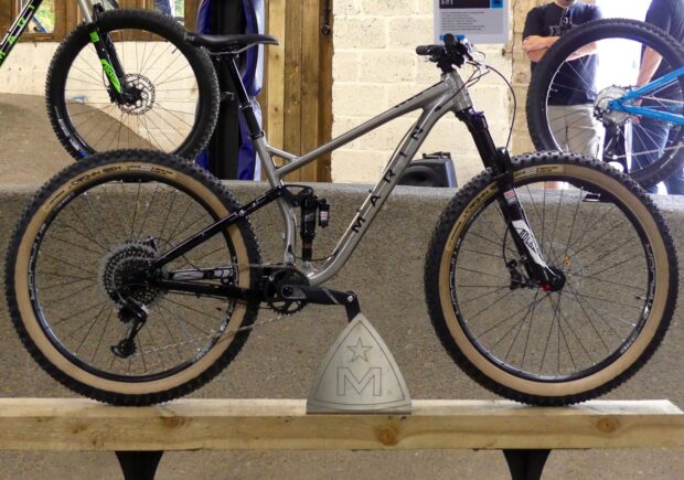A Marin mountain bike is displayed indoors with technical components visible, HD Desktop Wallpaper