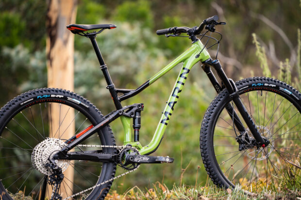 A Marin mountain bike is parked outdoors with lush greenery in the background, HD Desktop Wallpaper