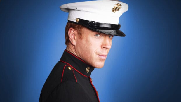 A Marine officer in formal uniform is posing against a blue background with Homeland Wallpapers, HD Desktop Wallpaper