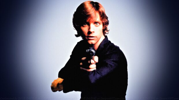 Mark Hamill looks focused while aiming a gun at the camera in this portrait, 2K Desktop Wallpaper