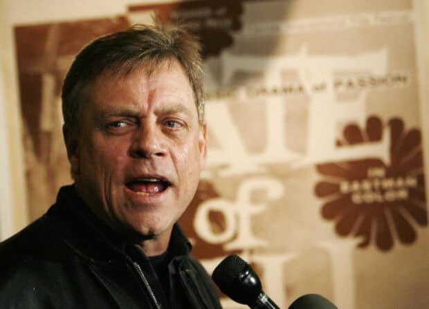 Mark Hamill speaking into a microphone at a public event, HD Desktop Wallpaper