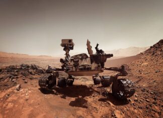 The Mars Curiosity Rover explores rocky terrain on Mars with detailed instruments and wheels, 2K Desktop Wallpaper