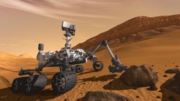 The Mars Curiosity Rover is captured examining rocks on the surface of Mars, HD Desktop Wallpaper