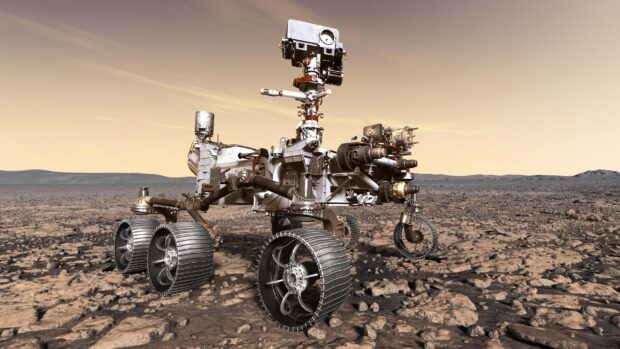 The Mars Curiosity Rover explores the rocky terrain on Mars under a yellow sky, 2K Desktop Wallpaper