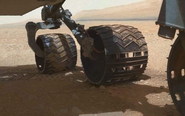 The Mars Curiosity Rover wheels travel over rocky terrain on Mars surface, HD Desktop Wallpaper