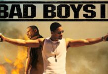 Martin Lawrence and Will Smith stand back to back aiming guns, 2K Desktop Wallpaper