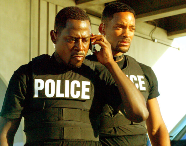 Martin Lawrence and Will Smith are dressed in police gear during a tense scene, HD Desktop Wallpaper