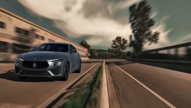 A Maserati Levante driving fast on a street with blurred background and dynamic motion effect, 4K Desktop Wallpaper