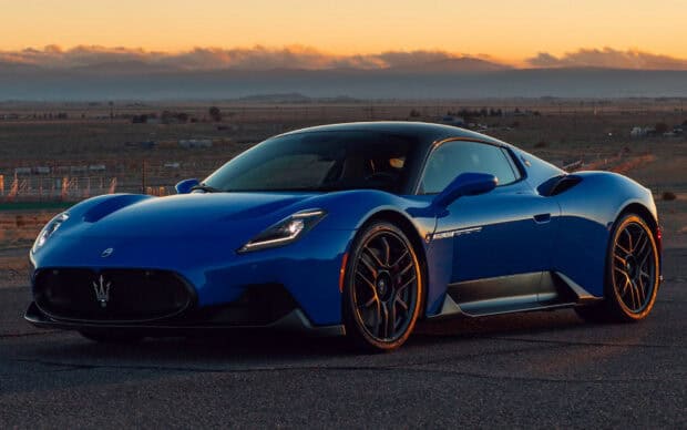 A blue Maserati Mc20 sports car parked at sunset, HD Desktop Wallpaper