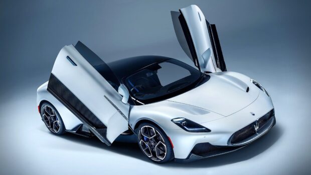 A silver Maserati Mc20 sports car with butterfly doors open is shown from above, HD Desktop Wallpaper