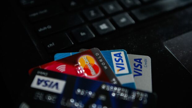 A closeup view of Mastercard and Visa credit cards on a laptop keyboard, HD Desktop Wallpaper