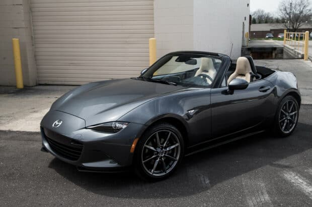 A gray Mazda MX 5 Miata parked near a building in an open area, HD Desktop Wallpaper