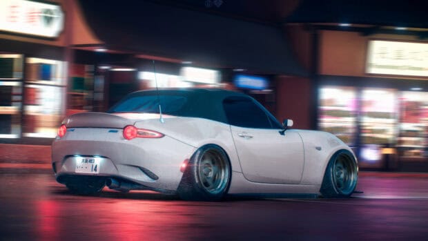 A white Mazda MX5 Miata is parked on a wet street with city lights reflected, 4K Desktop Wallpaper