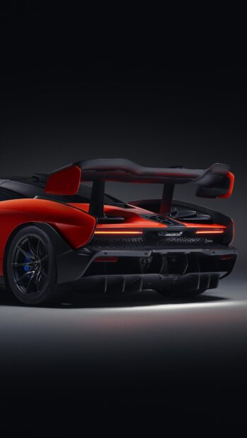 The image shows the rear wing and lights of a McLaren Senna car in a dark setting, 4K Phone Wallpaper