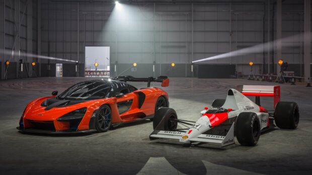 A McLaren Senna stands next to a classic race car inside a spacious garage, showcasing striking details and design, 4K Desktop Wallpaper