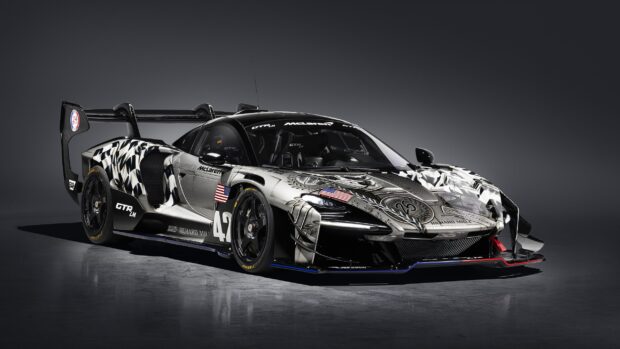 A McLaren Senna with detailed racing decals and American flags on display, 2K Desktop Wallpaper