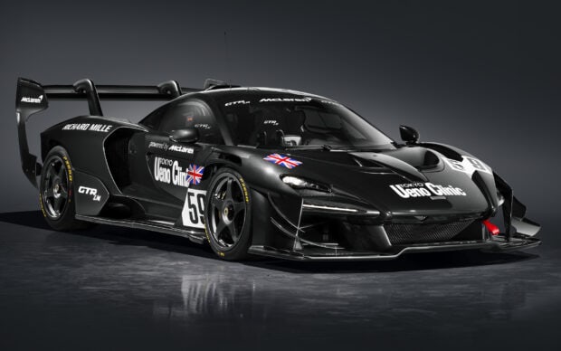 A black Mclaren Senna racing car with Ueno Clinic logos and British flags is captured in a studio setting, HD Desktop Wallpaper