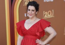 Melanie Lynskey smiles wearing a red dress at a television event, HD Desktop Wallpaper