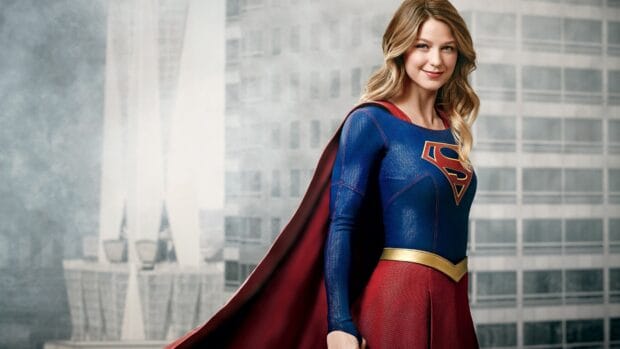 Melissa Benoist smiles confidently in her Supergirl costume with a city backdrop, 4K Desktop Wallpaper
